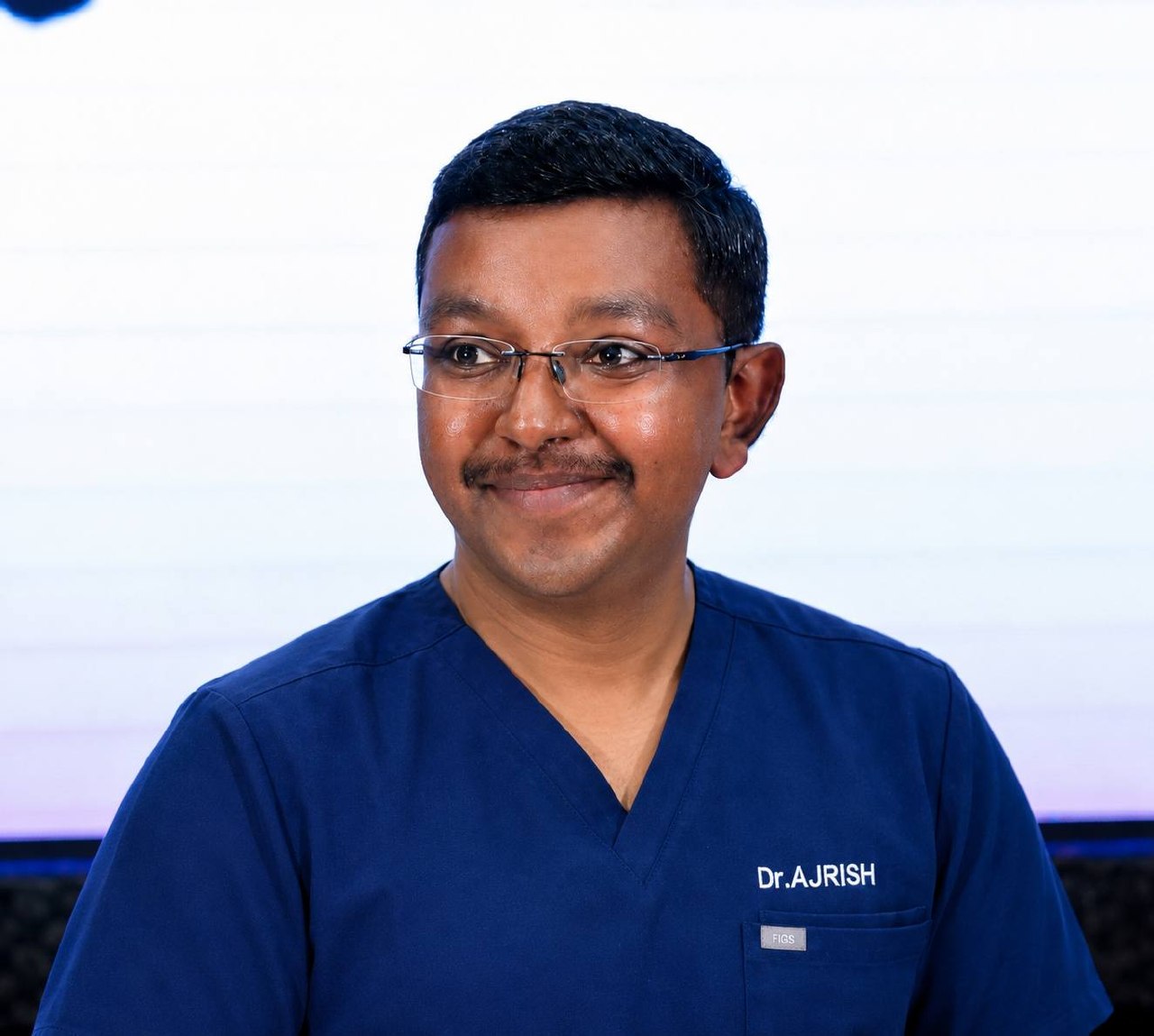 Dr. Ajrish George